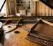 Piano technician inspecting soundboard for humidity damage Sunshine Coast